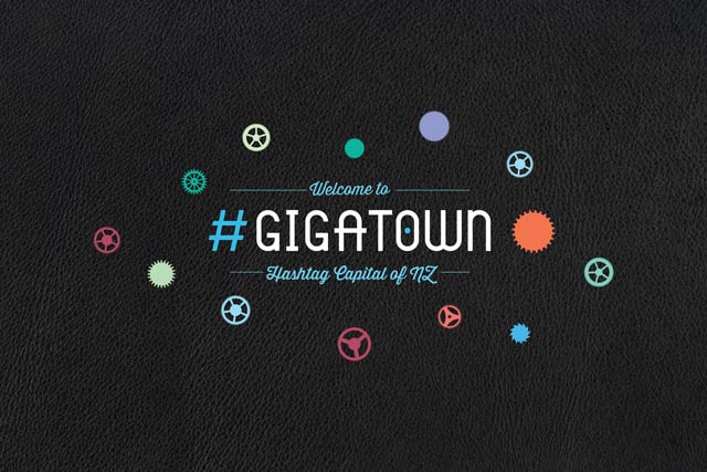 Computer showing Gigatown website page with logo